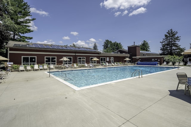 view of pool featuring a patio area