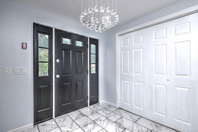 foyer featuring an inviting chandelier and light tile patterned floors