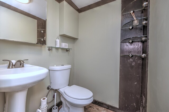 bathroom with sink, toilet, and tile patterned floors