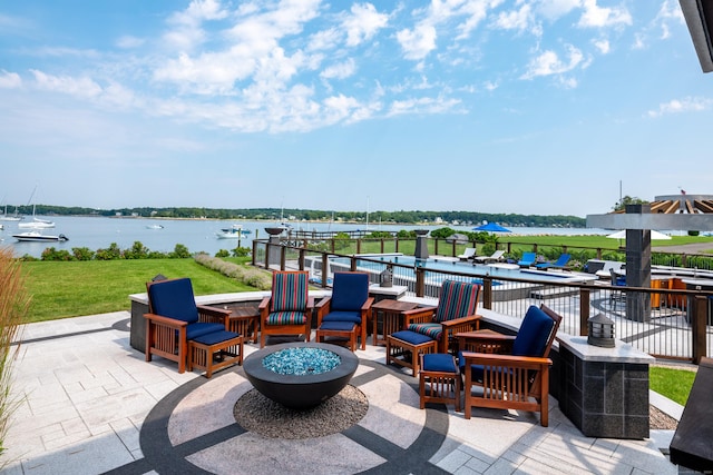 215 Uncas Point Rd, Guilford, CT 06437 - view of patio / terrace with a fire pit and a water view