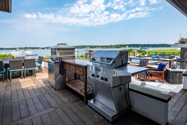 215 Uncas Point Rd, Guilford, CT 06437 - wooden deck featuring outdoor dining area and a water view