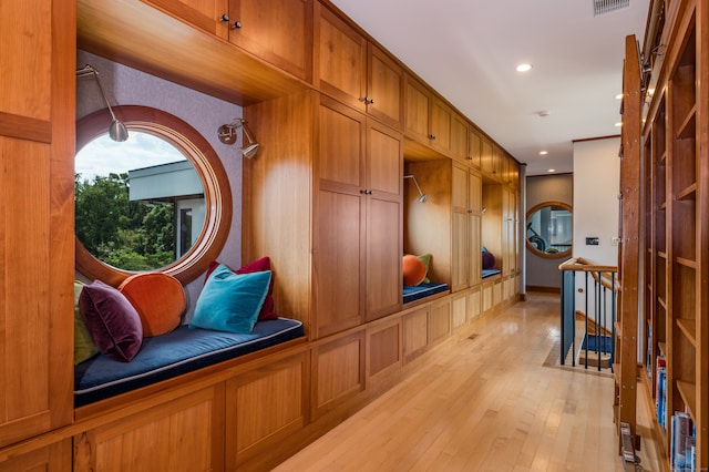 mudroom with light hardwood / wood-style floors