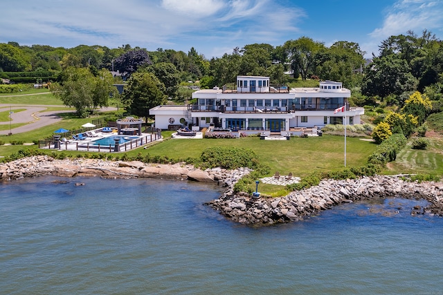 birds eye view of property with a water view