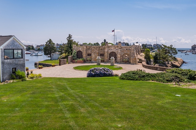 215 Uncas Point Rd, Guilford, CT 06437 - view of grassy yard with a water view and curved driveway