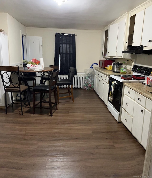 kitchen with white cabinetry, radiator, dark wood-type flooring, and range with electric stovetop