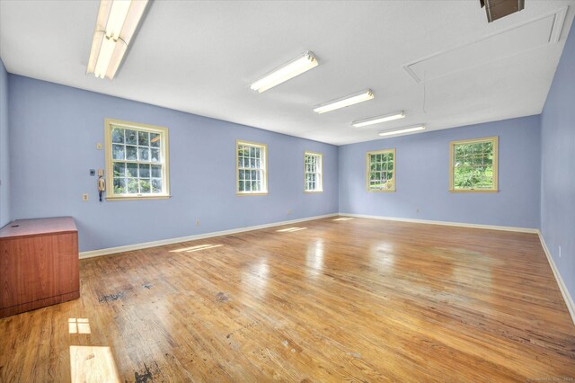 unfurnished living room featuring hardwood / wood-style flooring