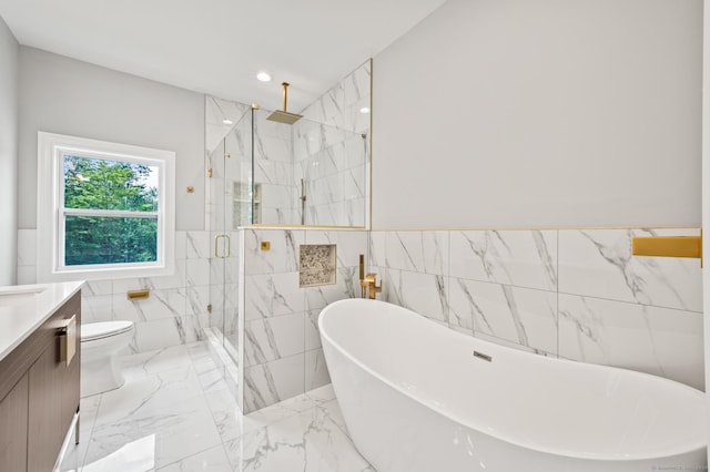 full bathroom featuring plus walk in shower, vanity, toilet, and tile walls