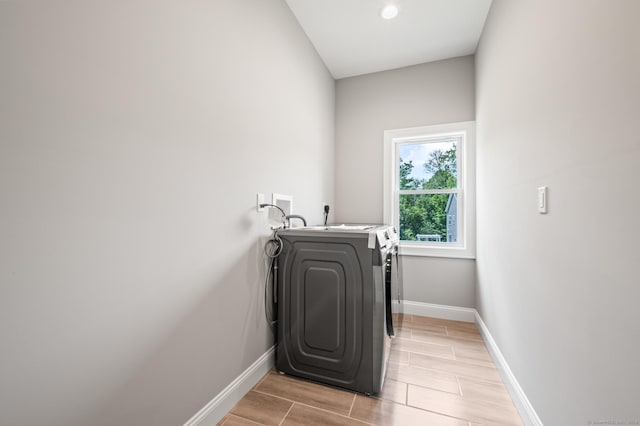 laundry area with washing machine and dryer