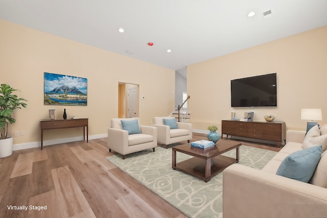 living room with light hardwood / wood-style flooring