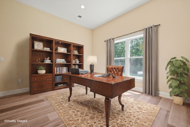 office space with light wood-type flooring