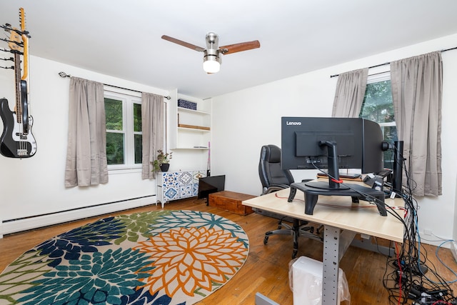 office featuring ceiling fan, a baseboard radiator, and hardwood / wood-style flooring