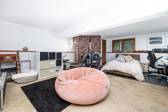 bedroom with beam ceiling and a wood stove