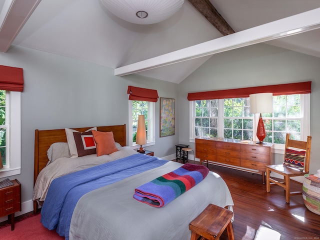 bedroom with multiple windows, vaulted ceiling with beams, and dark hardwood / wood-style flooring