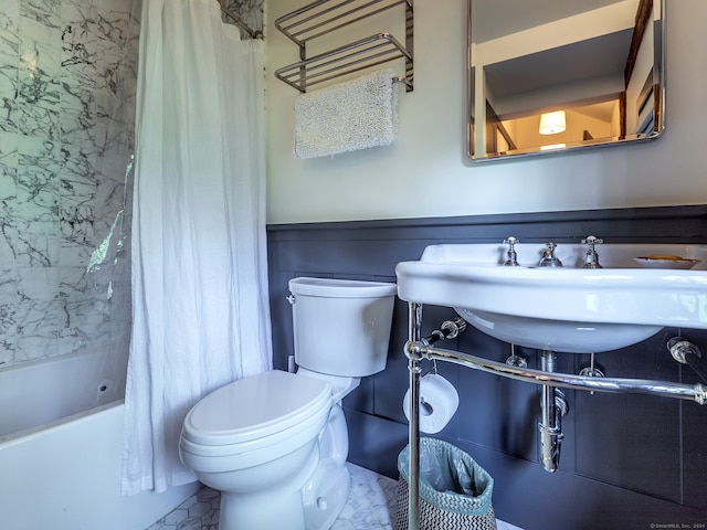 full bathroom featuring shower / tub combo, toilet, and sink