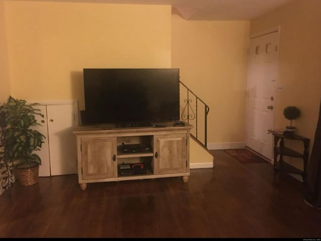 living room with dark wood-type flooring