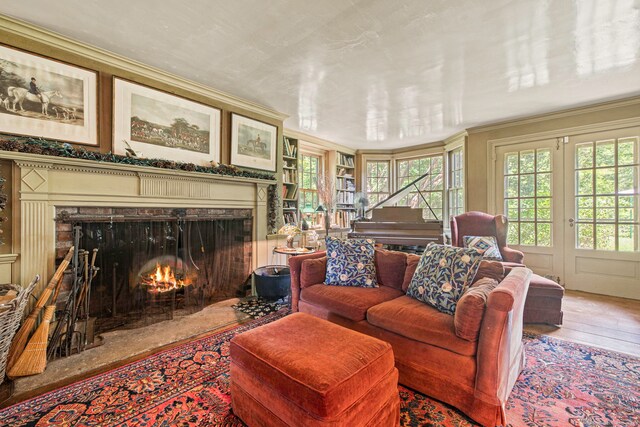 living room featuring crown molding and hardwood / wood-style floors