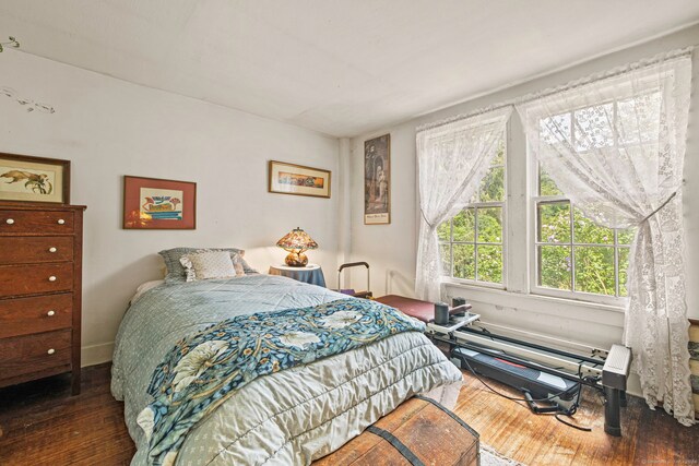 bedroom featuring dark hardwood / wood-style flooring