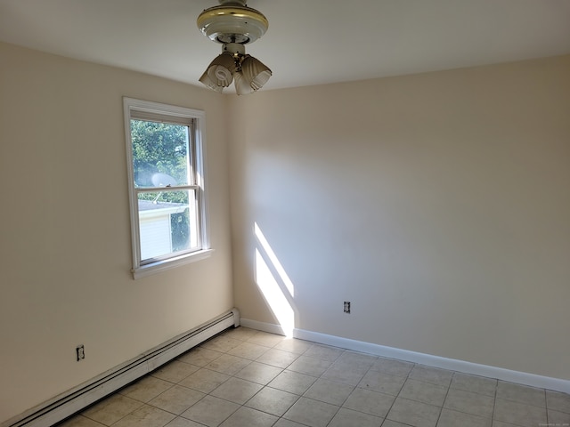 tiled empty room featuring ceiling fan and a baseboard radiator