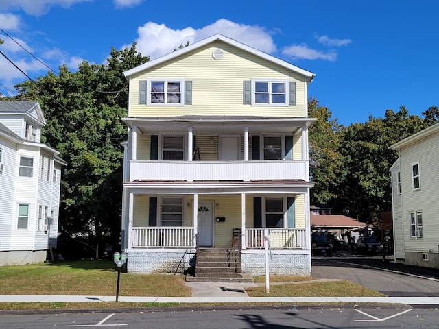 front facade featuring a front yard and a porch