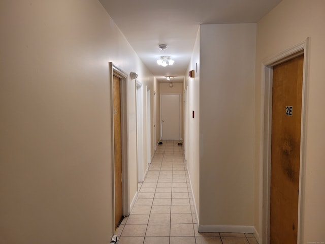 corridor with light tile patterned flooring