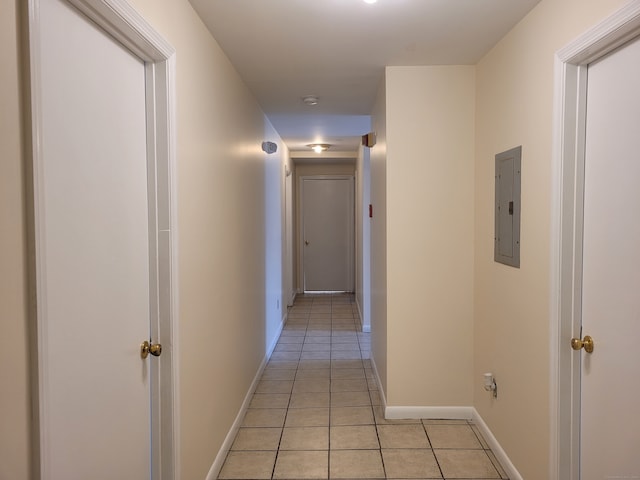 corridor with electric panel and light tile patterned floors