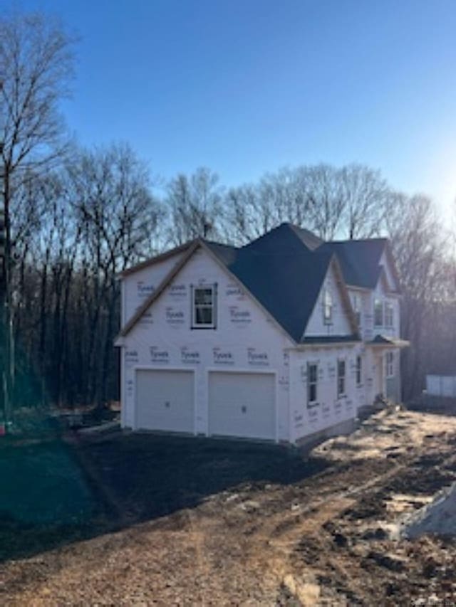 view of side of property with driveway