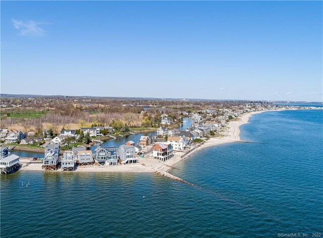 bird's eye view with a water view and a beach view