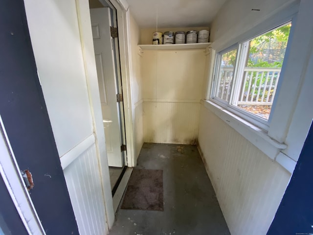 hallway with concrete flooring