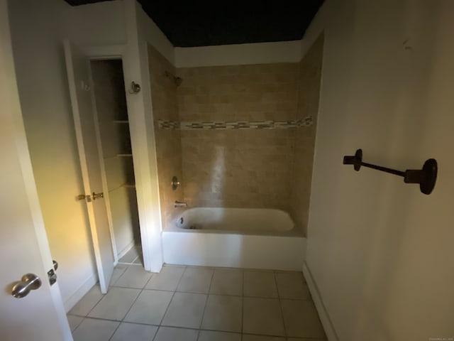 bathroom with tile patterned flooring and tiled shower / bath