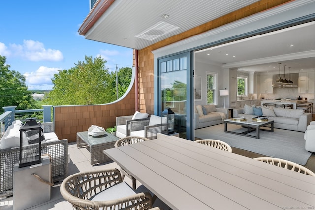 view of patio with a balcony and outdoor lounge area