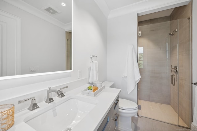 bathroom with a shower with shower door, crown molding, toilet, and vanity