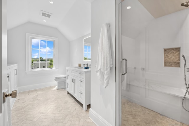 bathroom with vaulted ceiling, toilet, and vanity