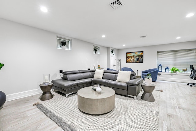 living area featuring recessed lighting, visible vents, baseboards, and wood finished floors