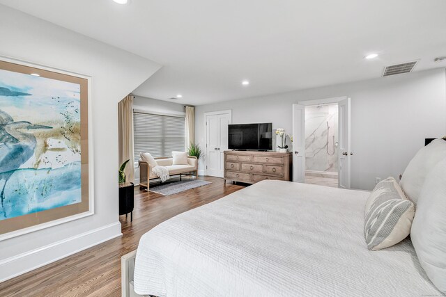 bedroom featuring wood finished floors, visible vents, and recessed lighting