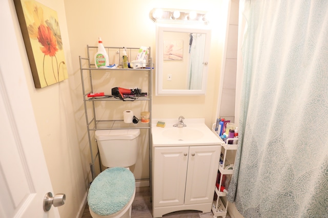 bathroom featuring vanity and toilet