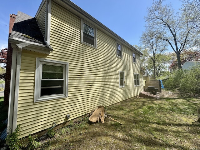 view of property exterior with a chimney