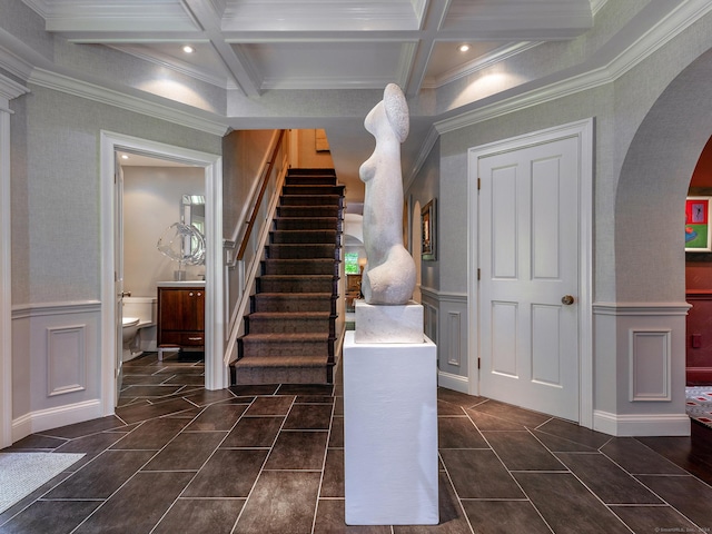 entryway featuring coffered ceiling, beam ceiling, and crown molding