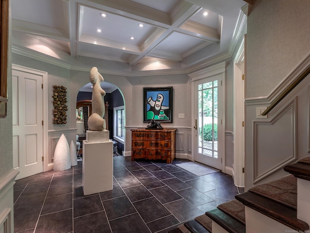 foyer with coffered ceiling, beam ceiling, and ornamental molding