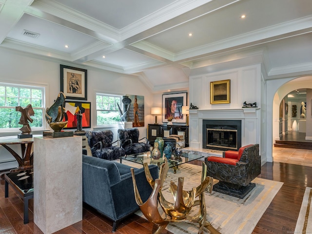 living room featuring coffered ceiling, ornamental molding, dark hardwood / wood-style floors, and beam ceiling