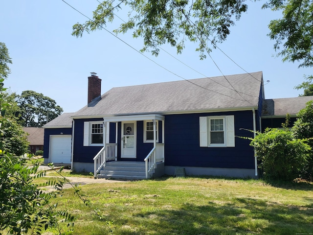 view of front of home featuring a garage and a front yard