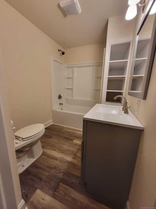 full bathroom with toilet, vanity, tub / shower combination, and hardwood / wood-style flooring