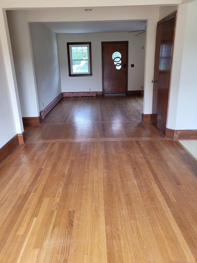 entrance foyer with light wood-type flooring and baseboard heating