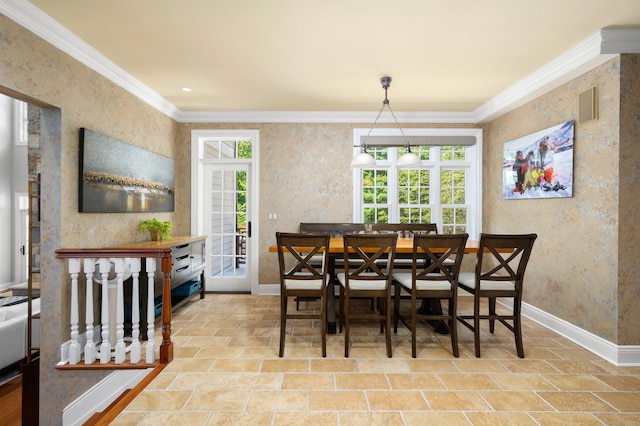 dining area featuring crown molding