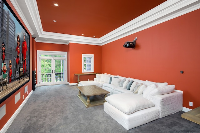 home theater with french doors, a raised ceiling, carpet floors, and crown molding