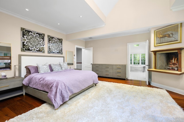 bedroom with crown molding and dark hardwood / wood-style flooring