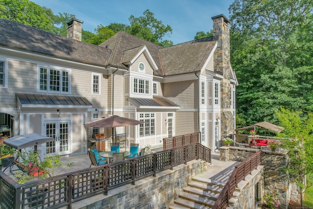 back of property with french doors and a patio