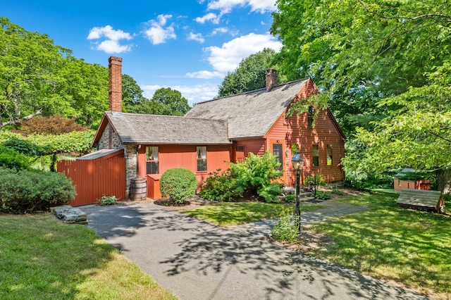 28 S Wig Hill Rd, Chester, CT 06412 - view of front of house with a chimney, a front lawn, and stone siding