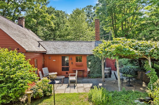 28 S Wig Hill Rd, Chester, CT 06412 - rear view of property featuring a patio and a chimney