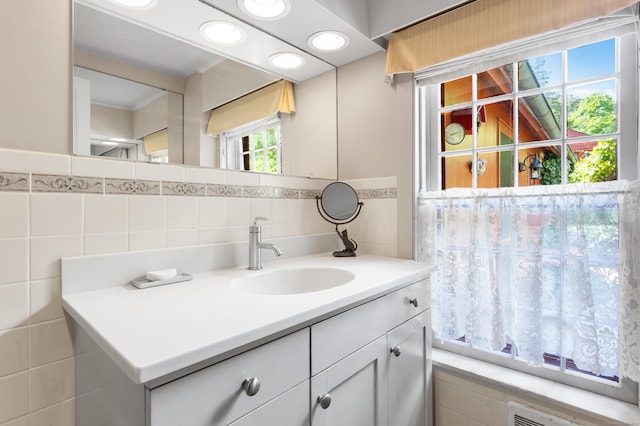 28 S Wig Hill Rd, Chester, CT 06412 - bathroom featuring vanity, tile walls, radiator, and tasteful backsplash