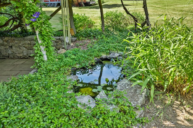 exterior details featuring a small pond